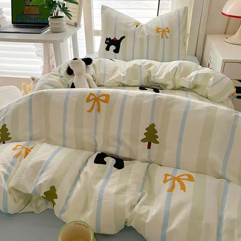A cream and blue cartoon style cotton bedding set with black cat embroidery by decorbites for cozy bedroom use