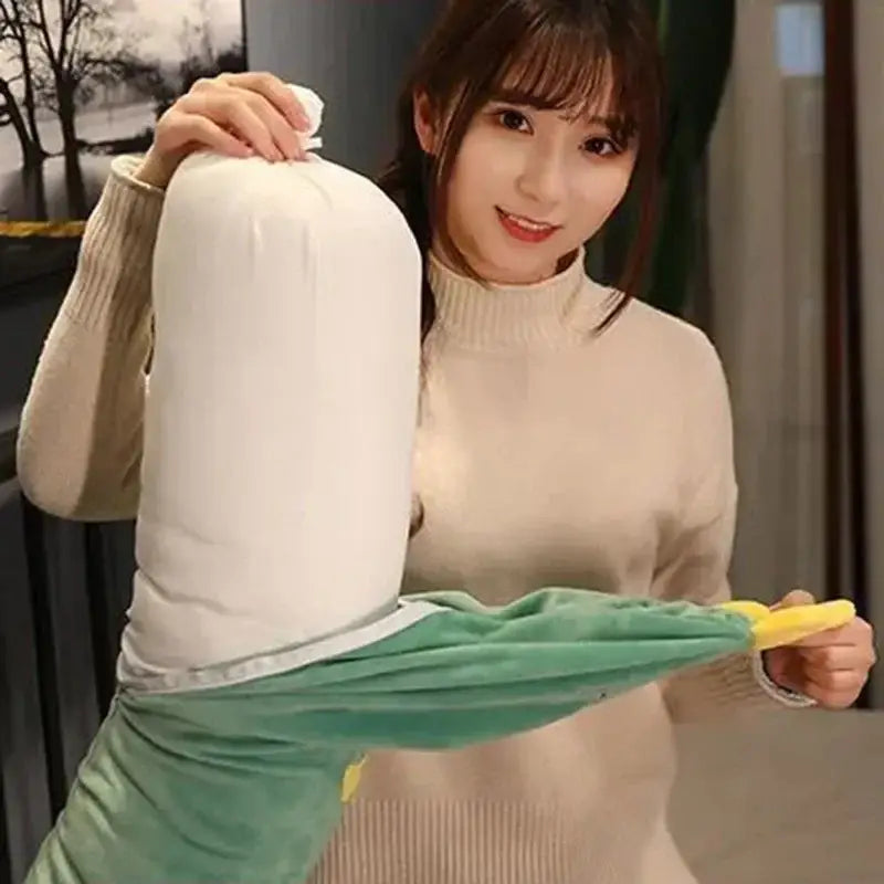 White plush banana-shaped comfort long body pillow with green leafy top and yellow stem for decorbites comfort long use