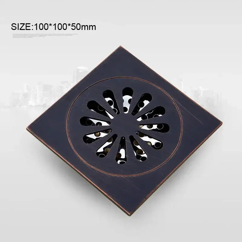 Square-shaped decorbites black bronze floor drain with circular petal cutouts for anti-odor bathroom use