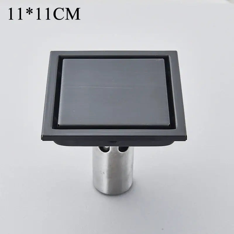 Black square floor drain with matte finish and silver metallic stand decorbites black anti-odor brass bathroom hardware 11x11 cm