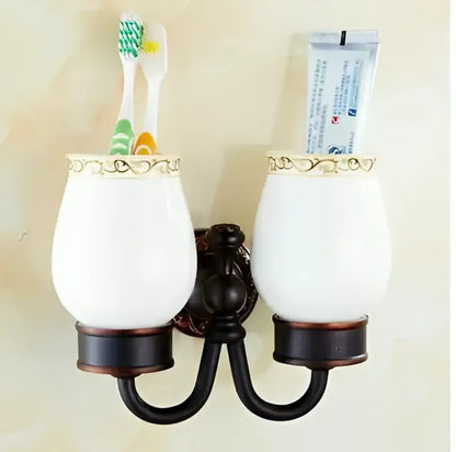 White ceramic toothbrush holder with gold trimmed rim and dark bronze bracket from decorbites carved flowers blackened copper set