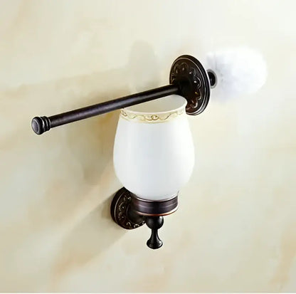 Antique bronze-finished toilet brush holder with white ceramic cup featuring ornate decorbites carved flowers blackened copper detailing