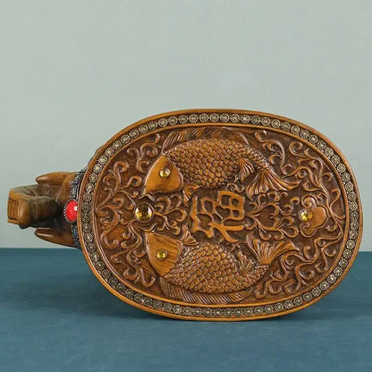 Hand-carved wooden decorative plaque with gold inlays featuring intricate fish and chinese characters for wealth attracting ornaments stool