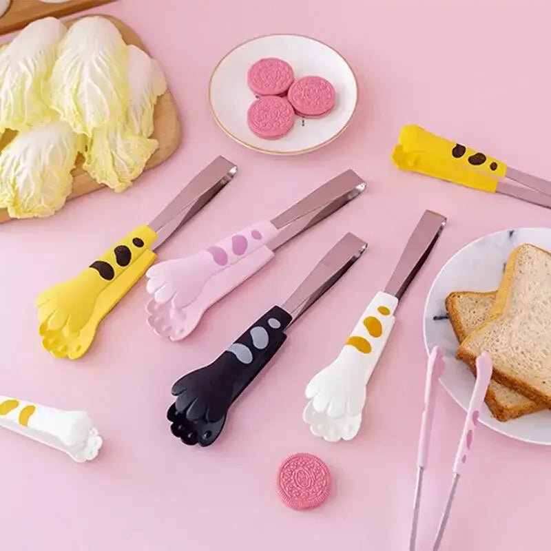 Cat paw stainless steel food tongs in yellow pink black and white with metallic silver handles for kitchen use