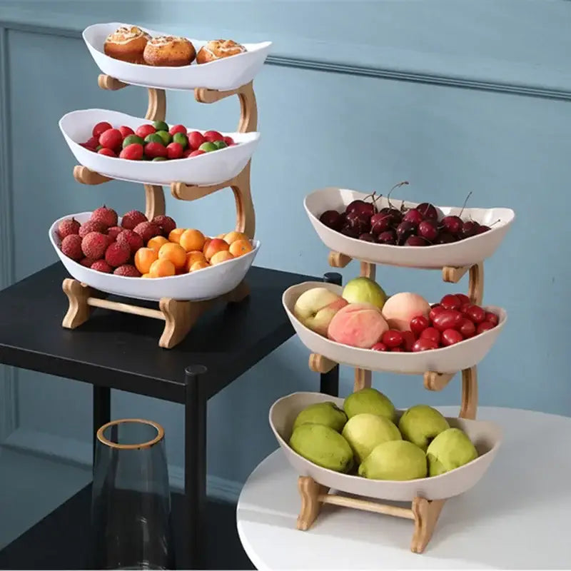 Three-tiered ceramic and teal table plates set with white bowls and light wood legs for dining room and kitchen use