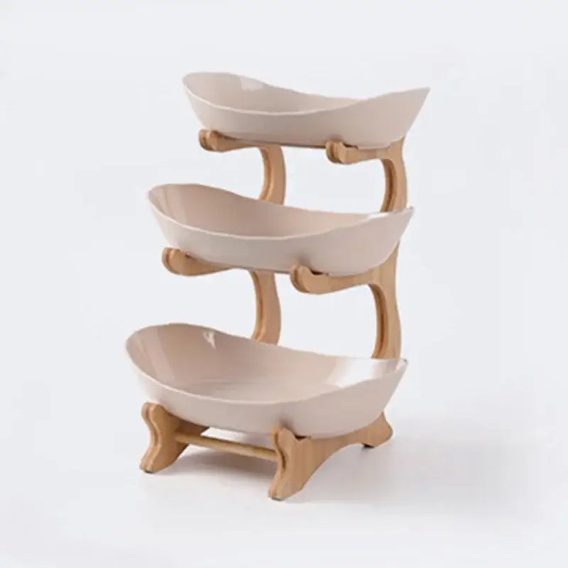 Three-tiered ceramic table plates set with teal bowls and light wood frame for dining room and kitchen use