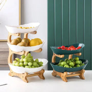 Three-layer table plates set with ceramic white and teal bowls on light wood stands for dining room and kitchen use