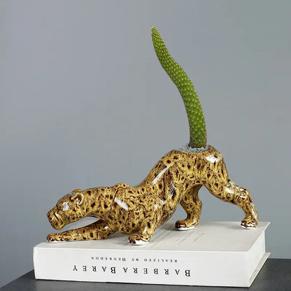 Glossy ceramic animal flowerpot leopard with tan and brown spots featuring a green cactus by decorbites ceramic