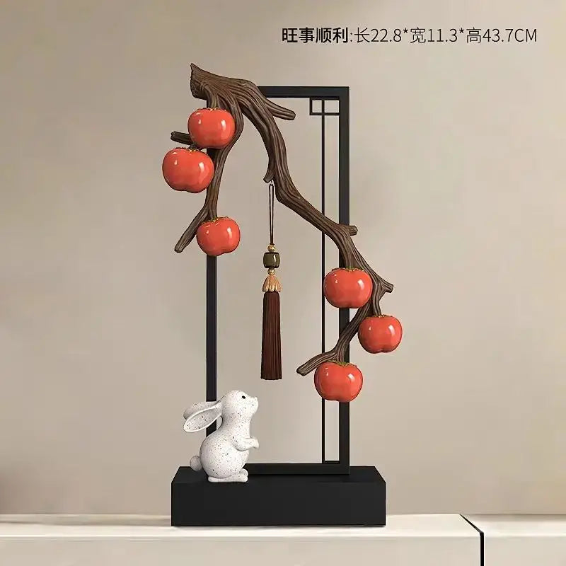 Ceramic home decor set featuring dark brown branch with glossy red persimmons and white rabbit for living room