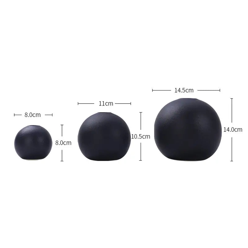 Set of three matte black ceramic round vases in varying sizes from the black white vase collection