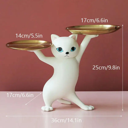 White ceramic cat figurine with blue eyes balancing gold plates, part of cat figurines storage tray for living room decor