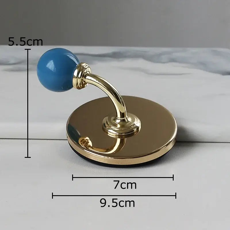 Blue ceramic knob wall hook with polished brass base for decorbites colorful wall storage organizer bedroom use