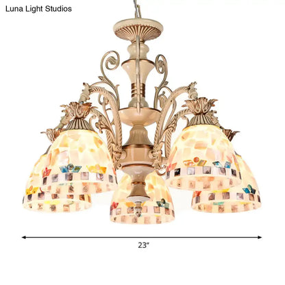 Beige mosaic chandelier with ornate metal arms and colorful stained glass panels in tiffany style pendant light design