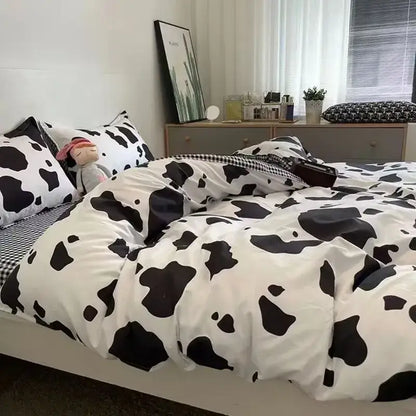 Checkerboard black and beige satin duvet cover set featuring a black and white cow print cover set for bedroom bedding
