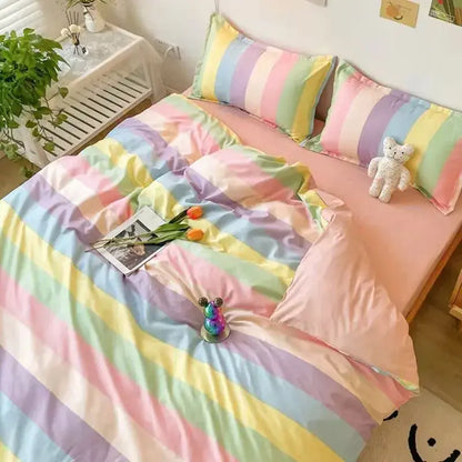 Pastel rainbow striped duvet cover set with matching pillowcases displayed alongside checkerboard black and beige satin duvet cover set bedroom bedding