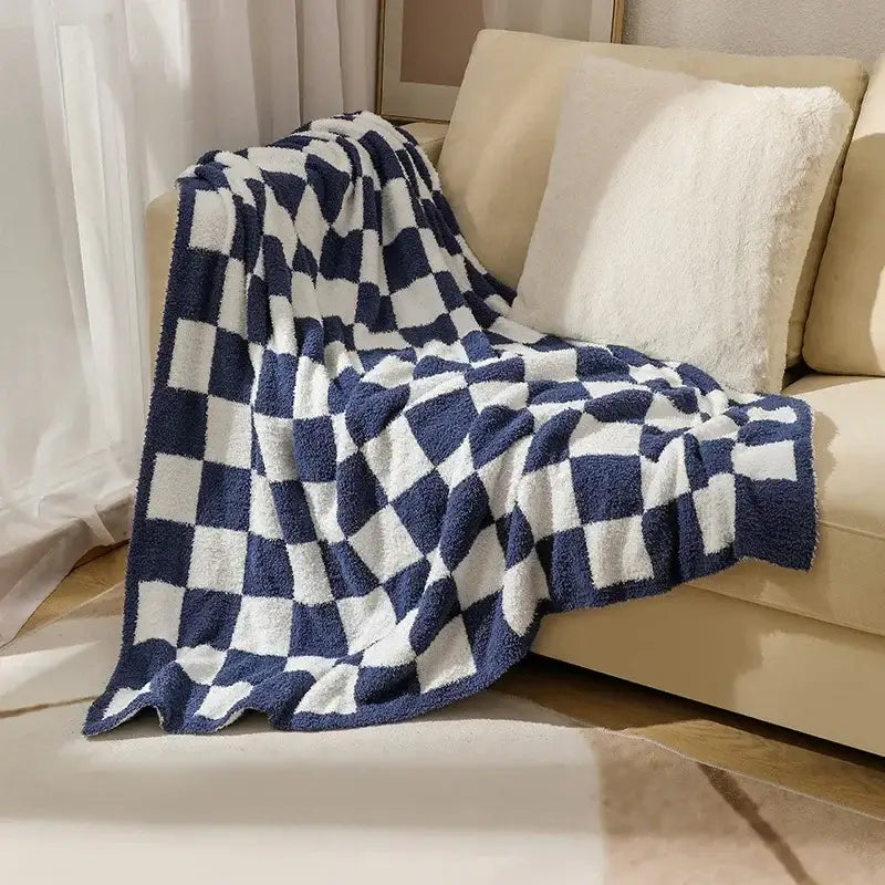 A cozy navy and white plush knit checkerboard blanket by decorbites perfect for bedroom and living room decor