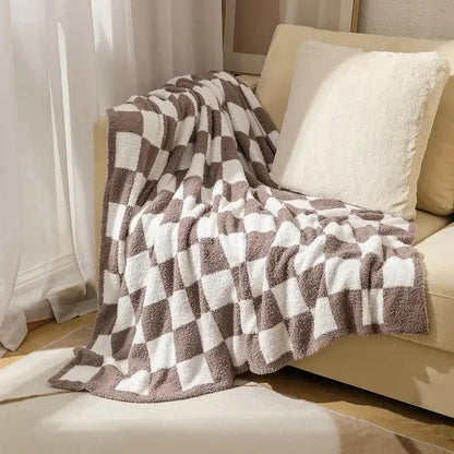 A plush decorbites knit checkerboard blanket in beige and white with a soft textured pattern for bedroom and living room decor