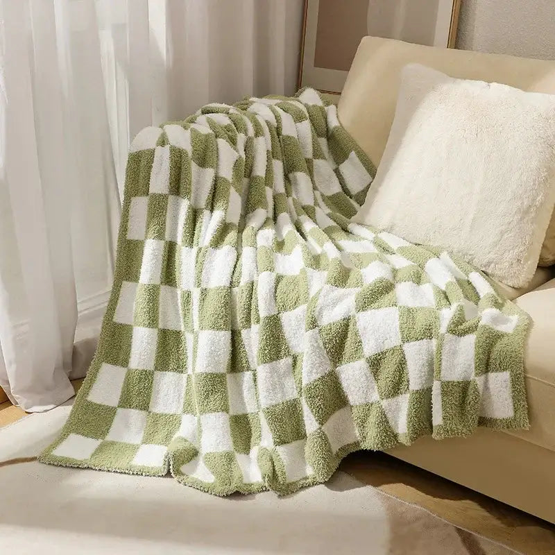 A soft plush green and white knit checkerboard blanket from decorbites ideal for bedroom and living room decor