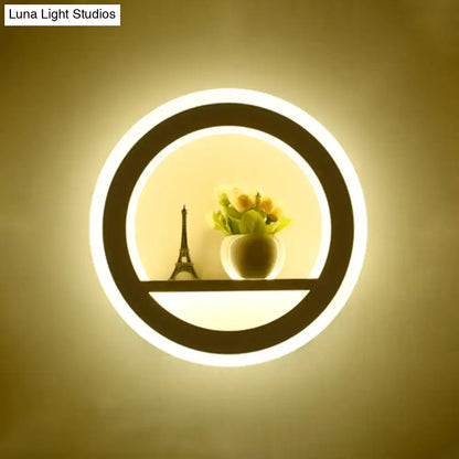 Cheerful white smiling sun led wall sconce with glowing circular white ring illuminating eiffel tower model and yellow flowers