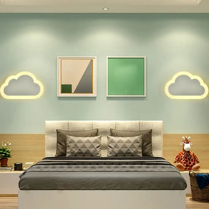 A cheerful white smiling sun led wall sconce bedroom light above a cozy bed with a beige headboard and gray geometric bedding