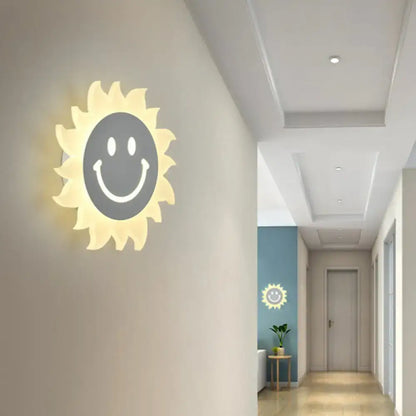 Cheerful white smiling sun led wall sconce glowing with illuminated face design for bedroom lighting