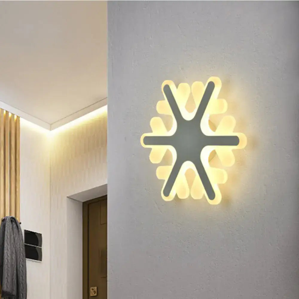 Modern star-shaped cheerful white smiling sun LED wall sconce with minimalist layered yellow glowing petals for bedroom light