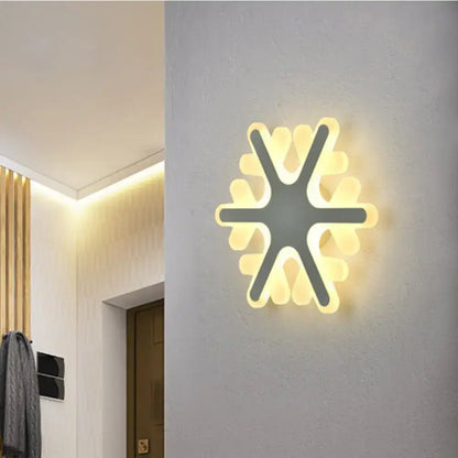 Modern star-shaped cheerful white smiling sun LED wall sconce with minimalist layered yellow glowing petals for bedroom light
