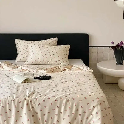 Cream-colored satin bedding set with delicate strawberry print featuring decorbites cooling quilt for bedroom decor
