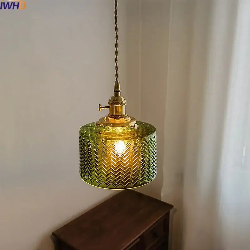 Chevron green glass pendant light with brass hardware featuring a chevron pattern for kitchen lighting