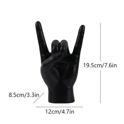 Chic black glossy resin hand gesture sculpture in rock pose for stylish living room decor