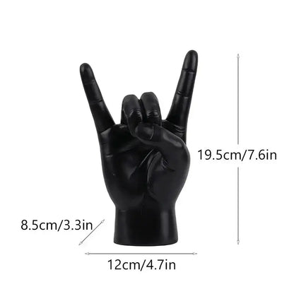 Chic black glossy resin hand gesture sculpture making a rock gesture for living room decor