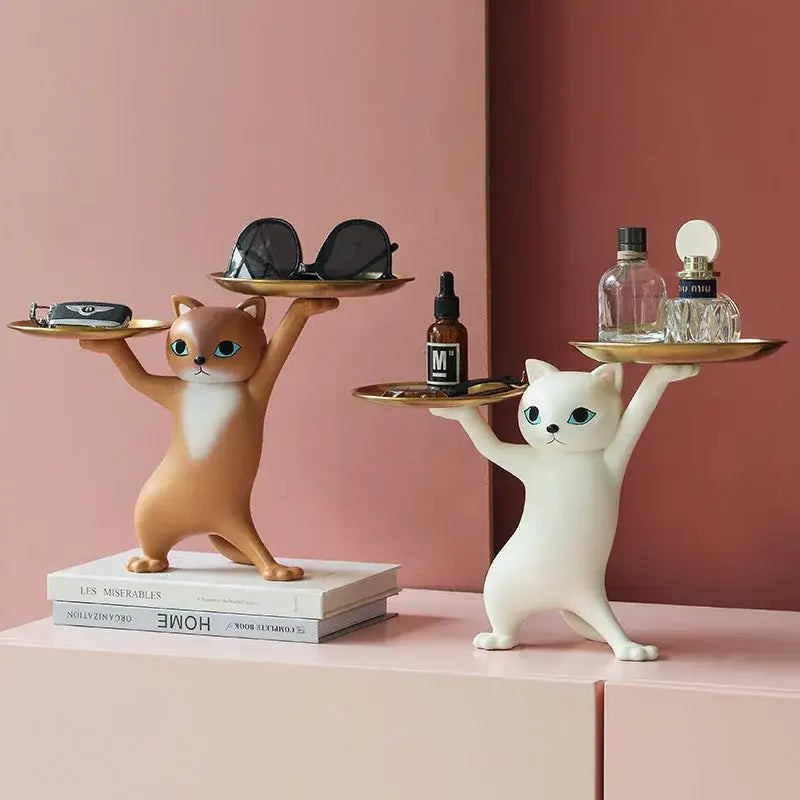 Two whimsical decorbites cat resin figurines in cream and gold holding trays as living room cat resin tray accessories