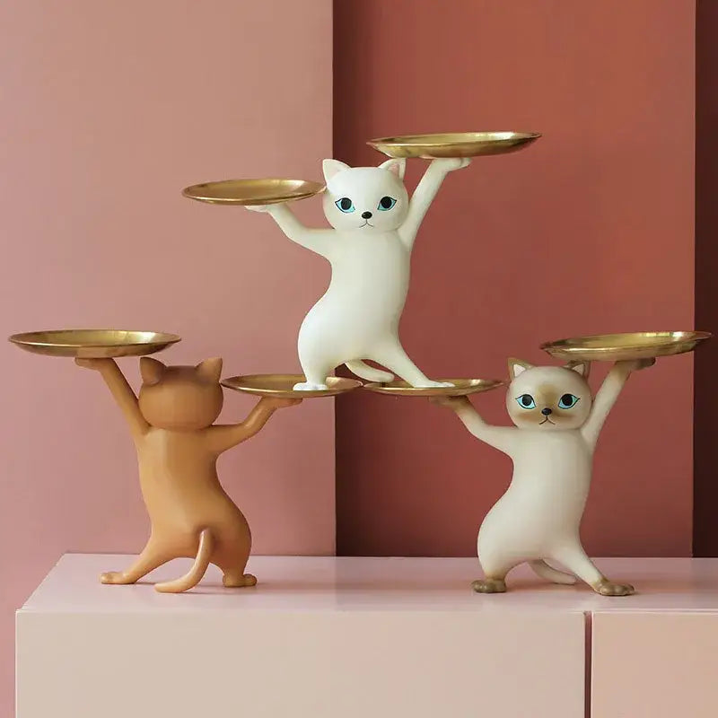 Chic cream and gold decorbites cat resin tray featuring white ceramic figurines with blue eyes balancing golden trays