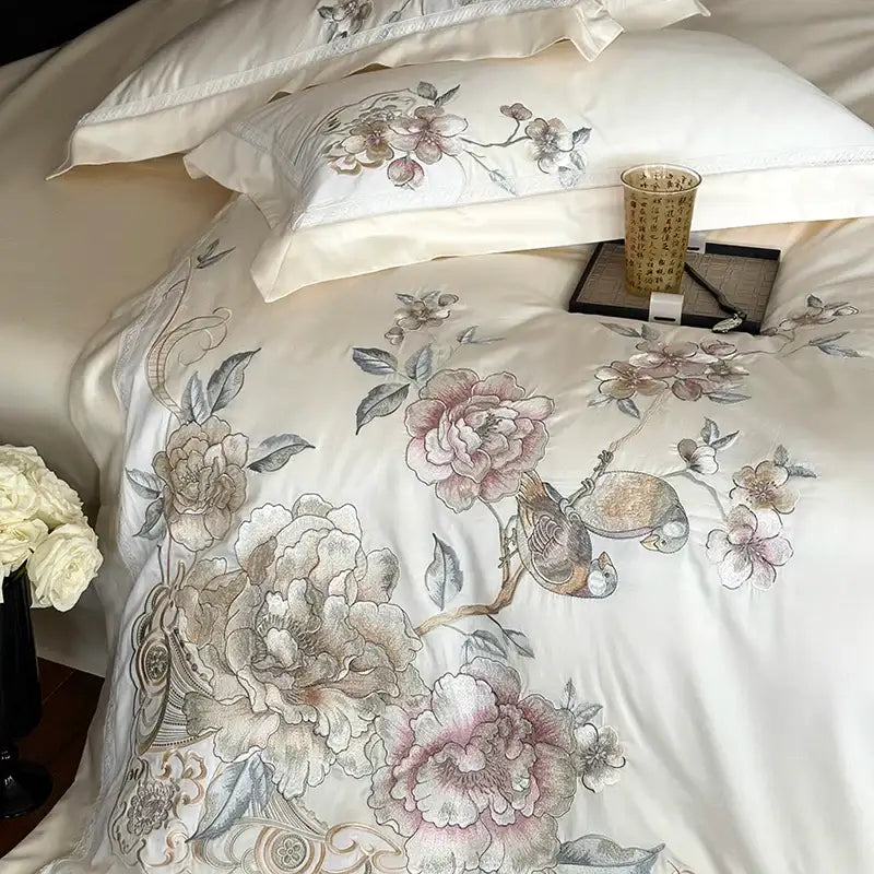 Cream-colored satin duvet cover with intricate chinese flowers bird embroidery in soft pink beige and gray tones bedding set