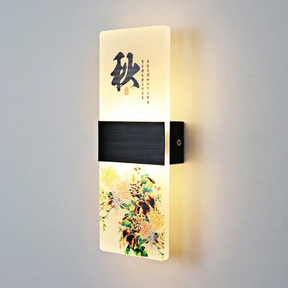 A modern wall lamp with an off-white acrylic shade featuring black chinese character autumn and floral decorbites acrylic shade