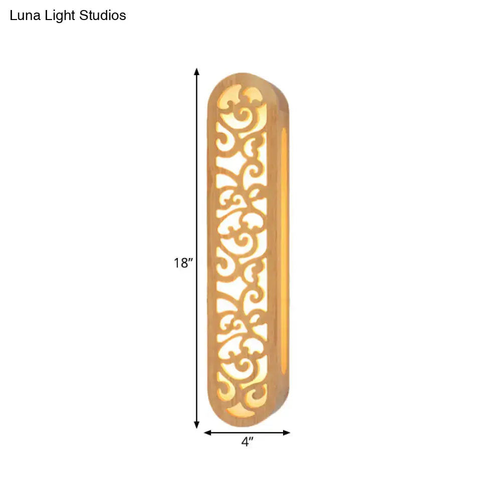 Chinese style beige carved wood wall light fixture with ornate gold-toned metal frame and intricate scrollwork patterns
