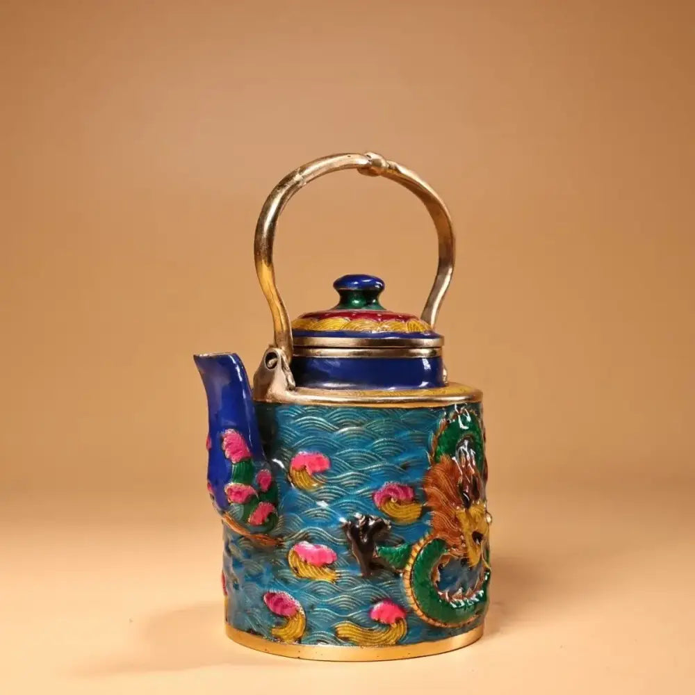 A vibrant blue and gold enamel pan teapot with intricate dragon and lotus designs from decorbites dragon cloisonné