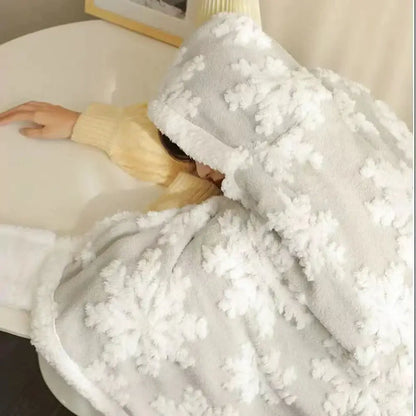 A cozy light gray wearable blanket with plush white snowflake appliqués in coral velvet by decorbites hooded christmas