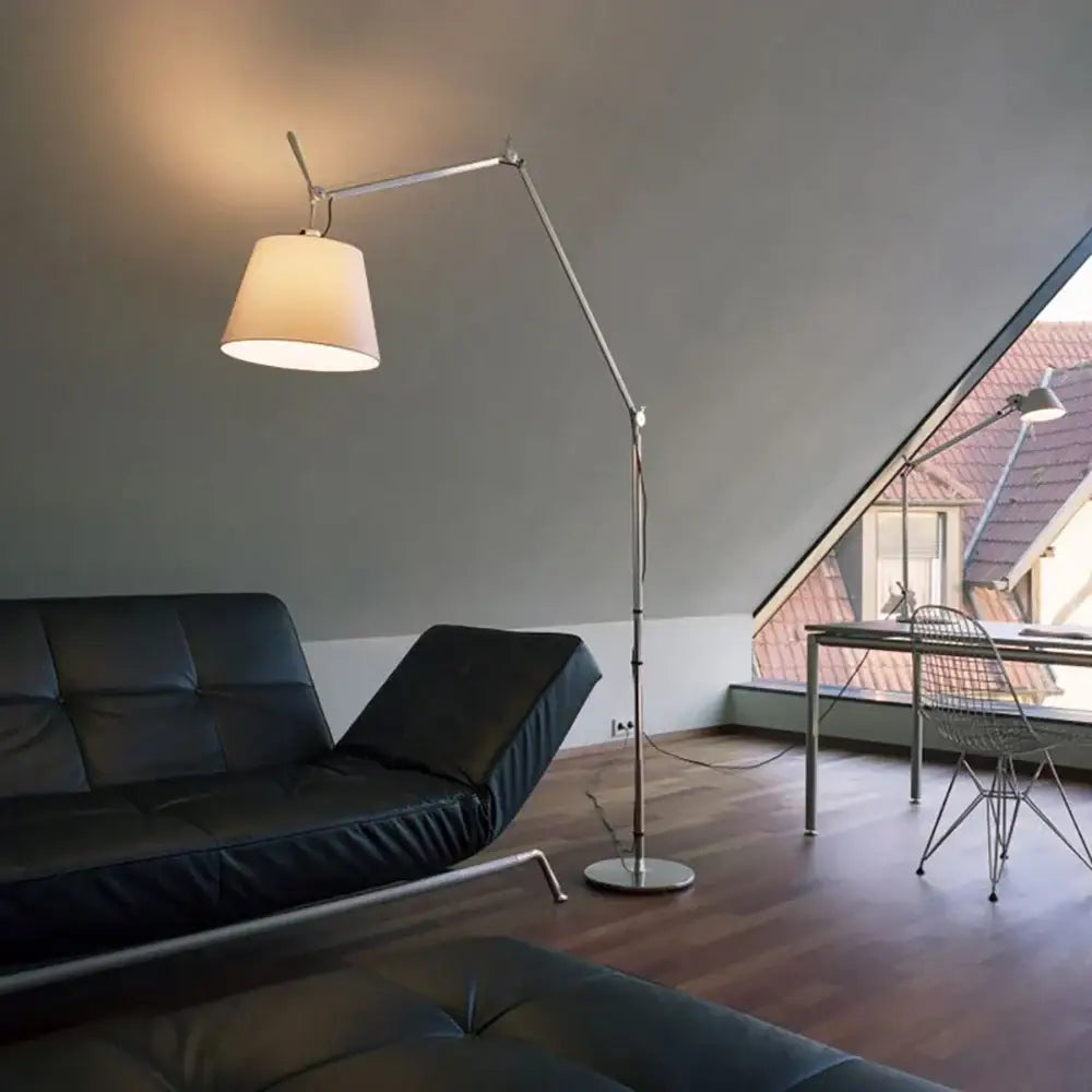 Modern silver floor lamp with a white fabric shade complementing decorbites adjustable industrial wall light decor