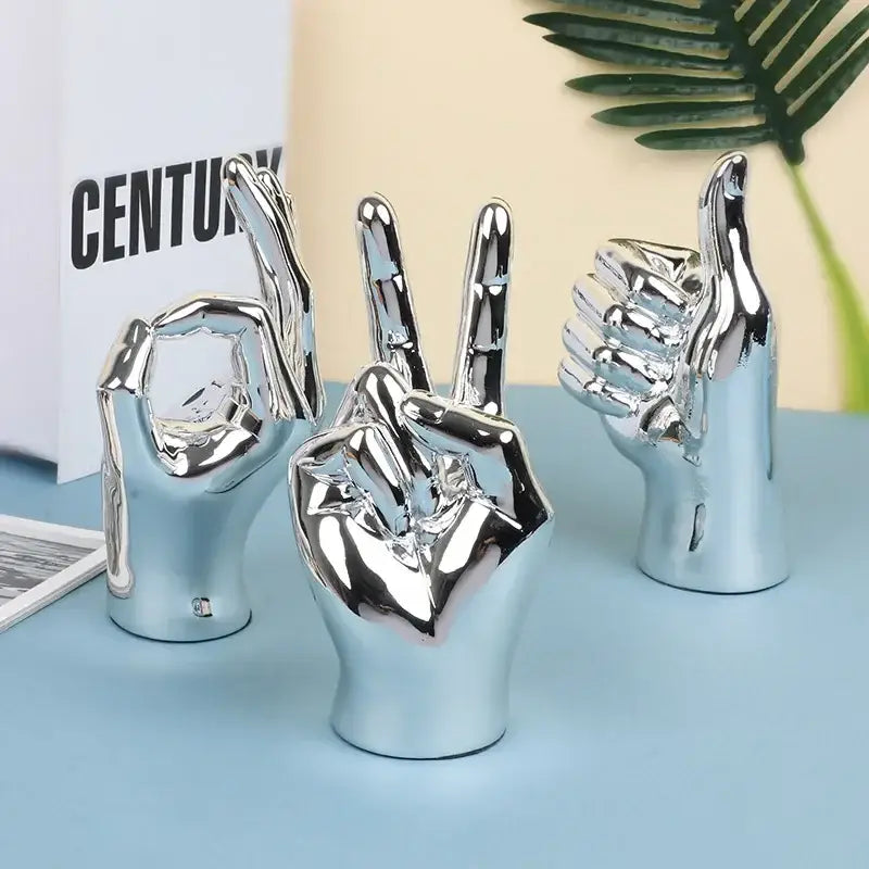 Shiny chrome-finished ceramic hand love gesture figurine sculpture for elegant living room decor display