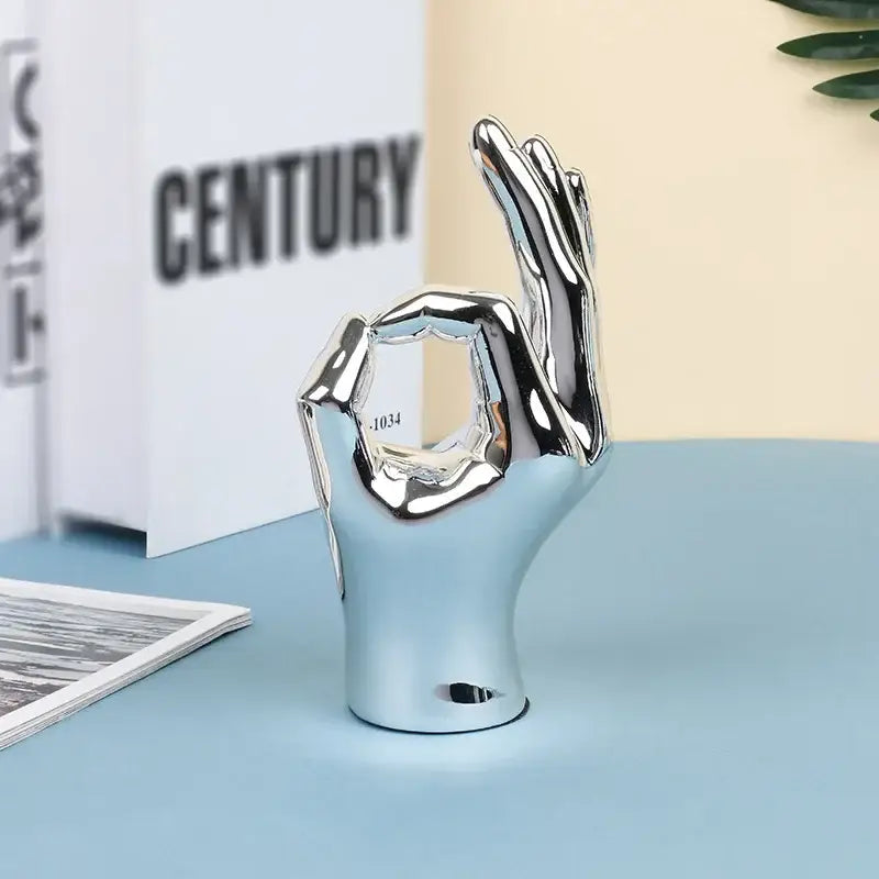 Shiny chrome ceramic hand love gesture figurine sculpture with polished reflective surface for living room decor