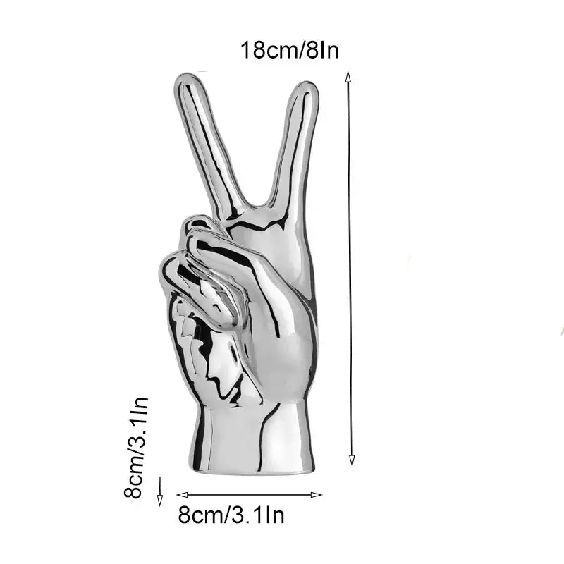 Shiny silver chrome ceramic love gesture figurine sculpture of a hand making the peace sign for living room decor