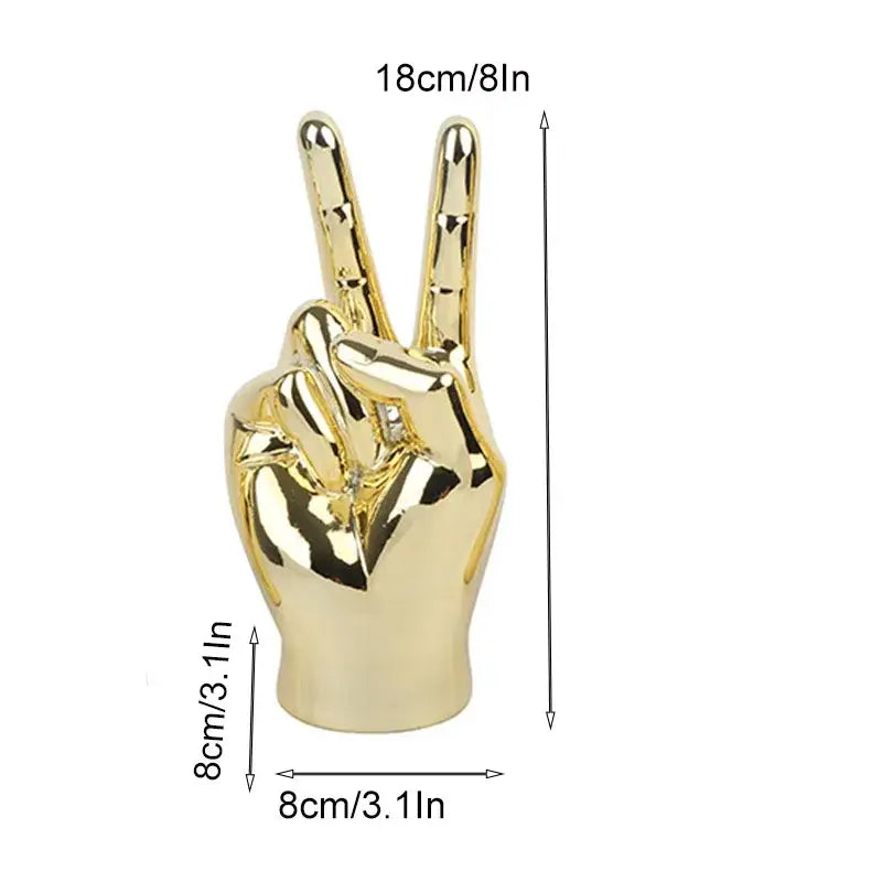 Golden glossy ceramic hand love gesture figurine sculpture making a peace sign for living room decor