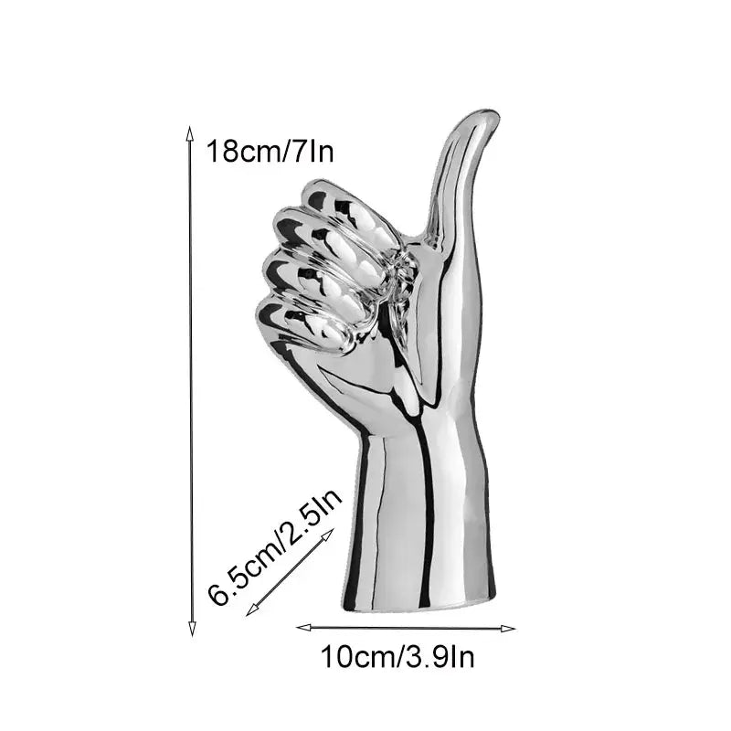Shiny silver metallic chrome ceramic love gesture figurine sculpture of a hand giving thumbs-up for living room decor
