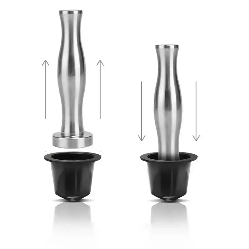 Stainless steel espresso tamp with sleek tapered handle and circular base featured alongside decorbites coffee capsule tower stand