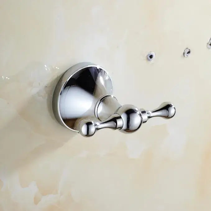 Chrome finished double towel hook with polished spherical accents from crystal bathroom set by decorbites brass