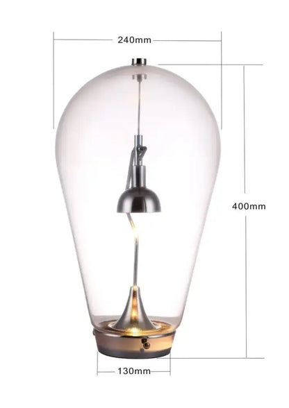 Clear glass pendant led table lamp with sleek metallic finish and teardrop design for modern bedroom lighting