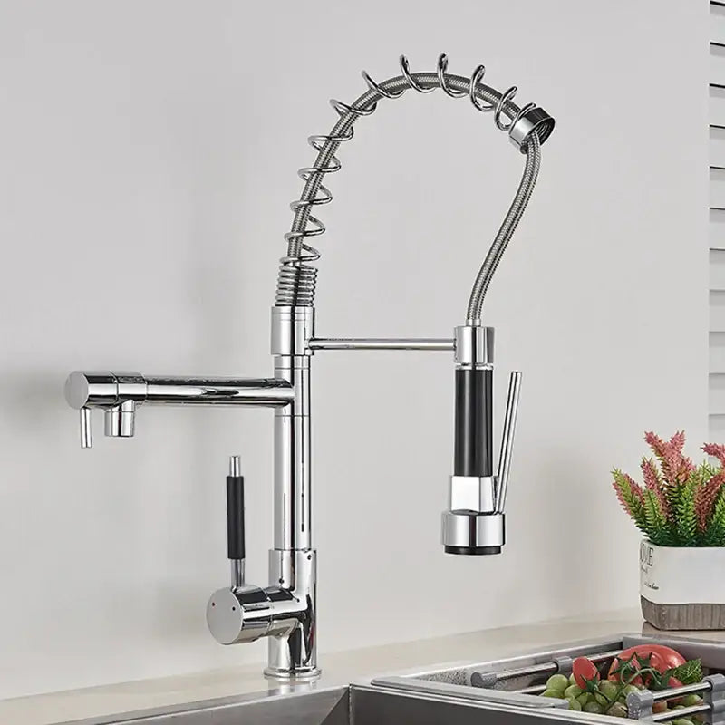 Chrome decorbites kitchen faucet with pull down spring hose features flexible coiled hose and black handle accents