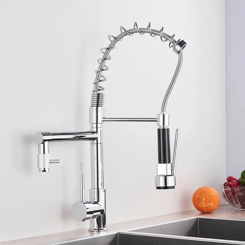 Chrome decorbites kitchen faucet with pull down spring hose featuring chrome finish and black accents on spray head