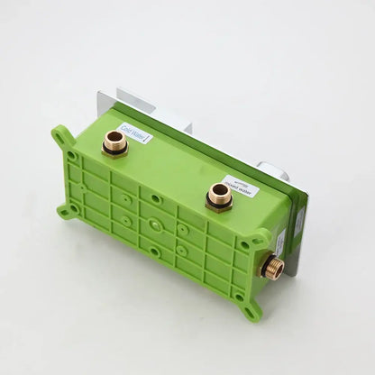 Green plastic shower mixer valve with brass fittings and labeled ports for cold mixed and hot water for control panel use